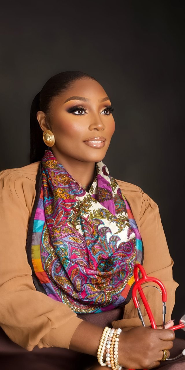 Portrait of Dr. Ayisat in a paisley silk scarf