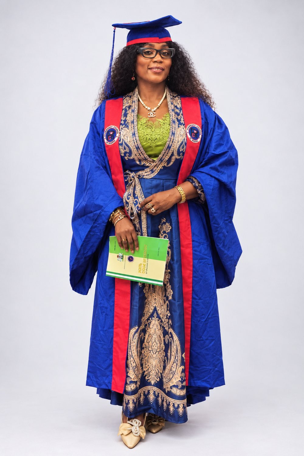 Full-length portrait of Dr. Ayisat in blue and red academic regalia