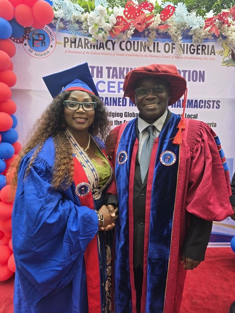 Dr. Ayisat with a Pharmacy Council of Nigeria official at her induction as a foreign-trained pharmacist