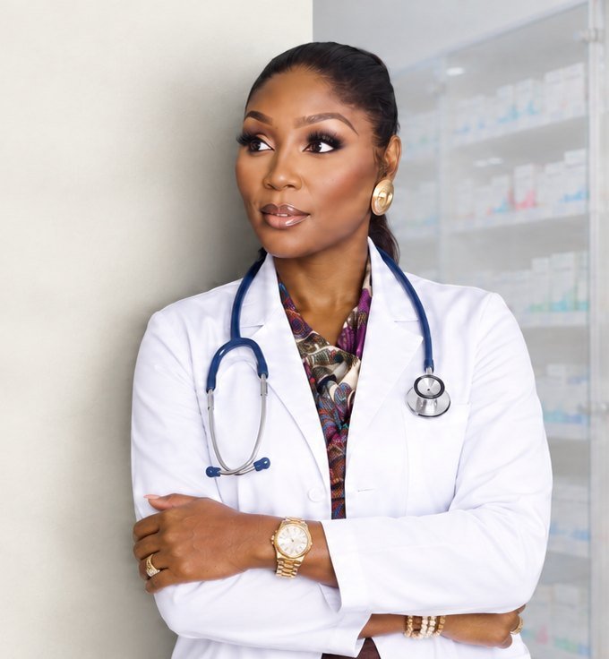 Dr. Ayisat standing beside pharmacy shelves